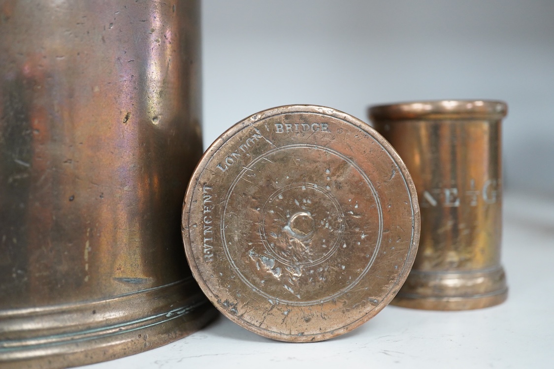 Three 19th century bell metal wine gill measures, two smaller examples engraved; ‘wine hill’, tallest 13.5cm